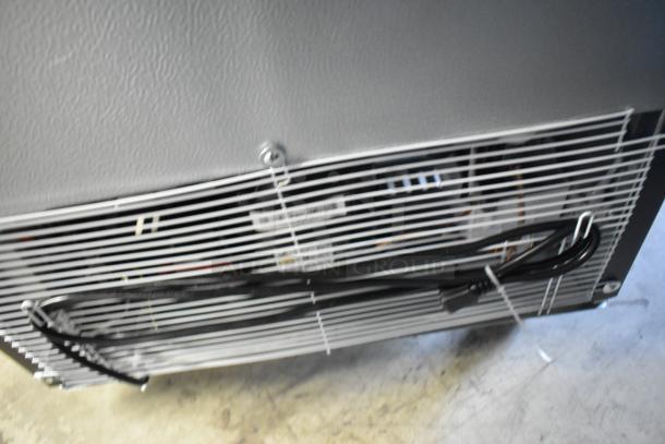 BRAND NEW KoolMore KM-MDR-1GD-10C metal commercial single door cooler. Visible cords, poly-coated racks, commercial casters. 115V, 1-phase.