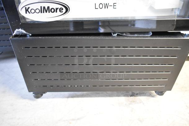 Brand new KoolMore KM-MDR-1GD-10C single door cooler merchandiser with poly-coated racks, commercial casters, minor scratch.