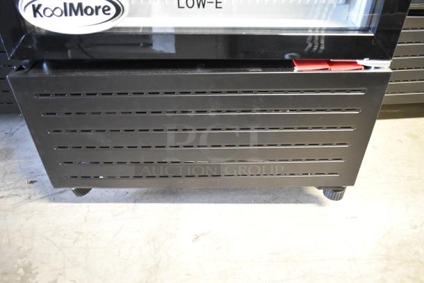 KoolMore KM-MDR-1GD-10C commercial cooler, new condition, single door, poly-coated racks, on casters, 115V, shown with brand logo.