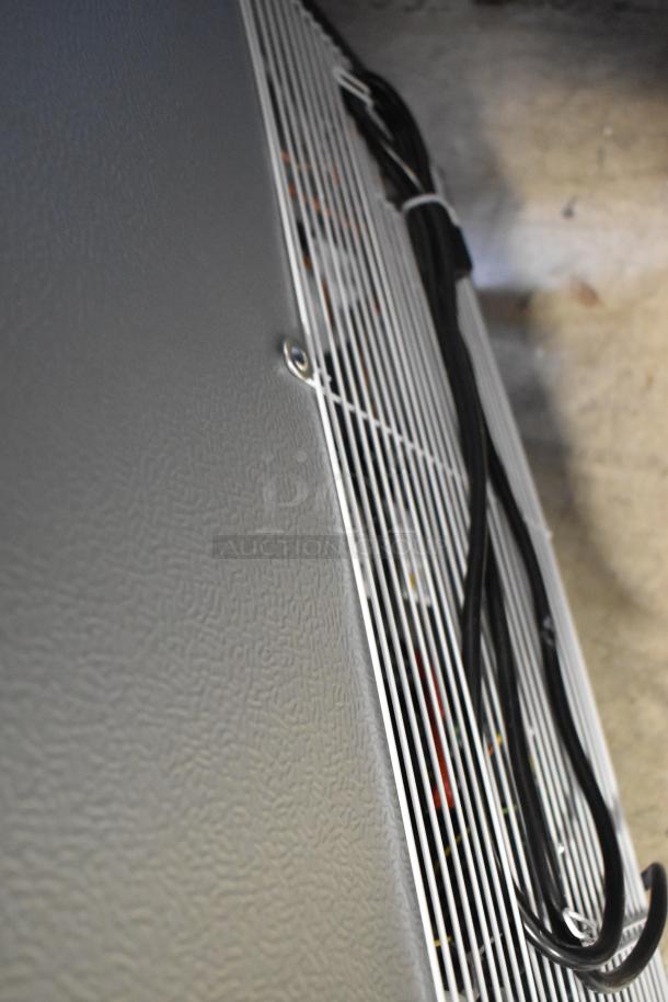 Brand new KoolMore KM-MDR-1GD-10C metal cooler, visible side panel, commercial casters, 115 volts, scratch and dent condition.