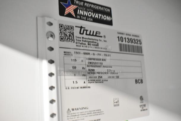 2021 True TSCI-600R-G-PH metal single door cooler with poly-coated racks. 115V, 1 phase. Label shows compressor and refrigerant info.