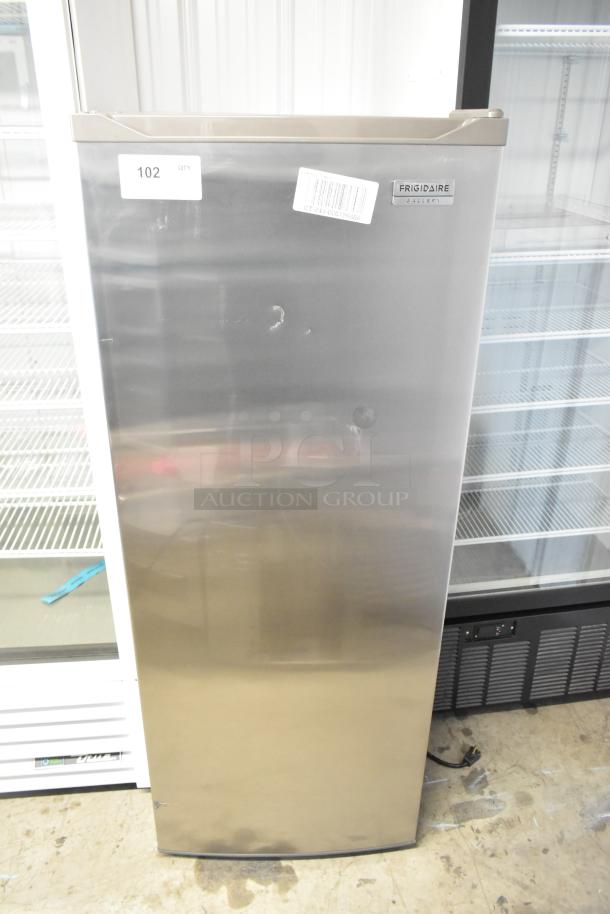 Frigidaire Gallery FGFRF699 upright freezer, single door, metal finish, 115 volts, good condition, visible labels and marking.