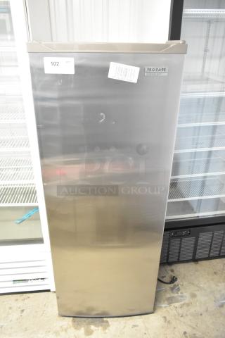 Frigidaire Gallery FGFRF699 upright freezer, single door, metal finish, 115 volts, good condition, visible labels and marking.