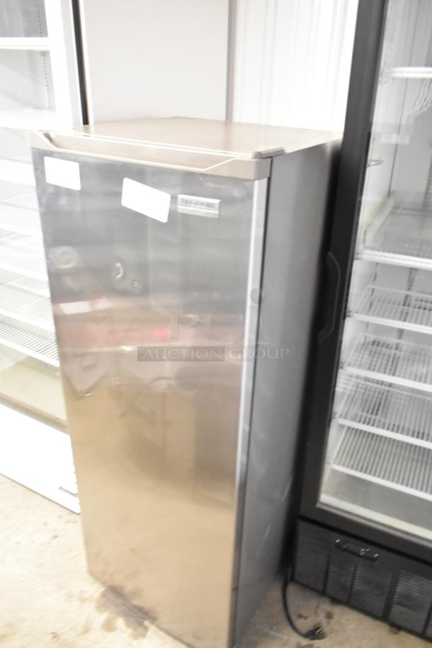 Frigidaire Gallery FGFRF699 upright freezer, metal finish, single door, 115 volts, 1 phase, good condition.