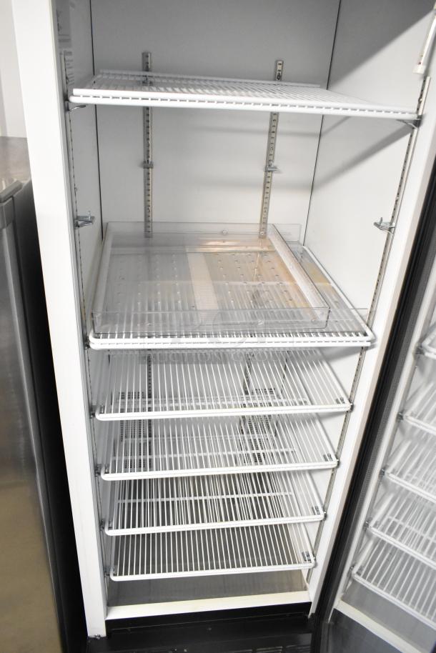 2019 Habco SE18 metal commercial single door reach-in cooler with poly-coated racks, on commercial casters, 115V, 1 Phase.