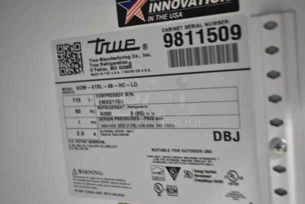 Label on 2020 True GDM-41SL-48-HC-LD cooler shows model, 115 volts, refrigerant R290, and serial number 9811509.