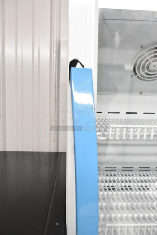 Accucold ARG3PV mini cooler merchandiser with poly coated racks, 115 volts, metal construction, new condition.