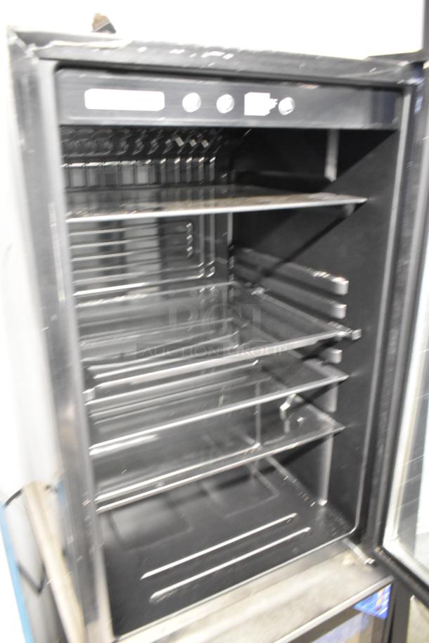 Frigidaire EFMIS155 metal mini cooler merchandiser, 115V, 1 Phase, in good condition with multiple wire shelves.