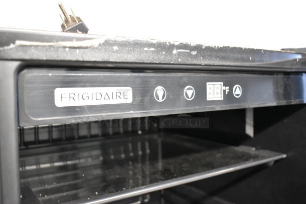 Frigidaire EFMIS155 metal mini cooler merchandiser with digital display. 115V, 1 phase. Visible shelf, good condition.