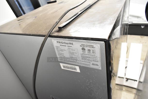 Frigidaire EFMIS155 Metal Mini Cooler Merchandiser, 115 Volts, 1 Phase. Features manufacturer label detailing specs.