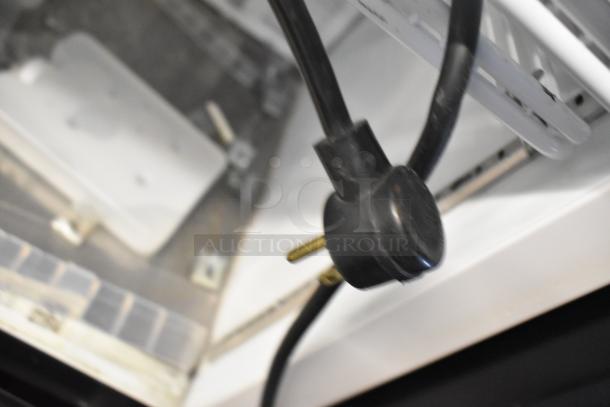 2019 Habco SE18 metal single door reach-in cooler; features poly-coated racks, visible power cord. 115 volts, 1 phase.