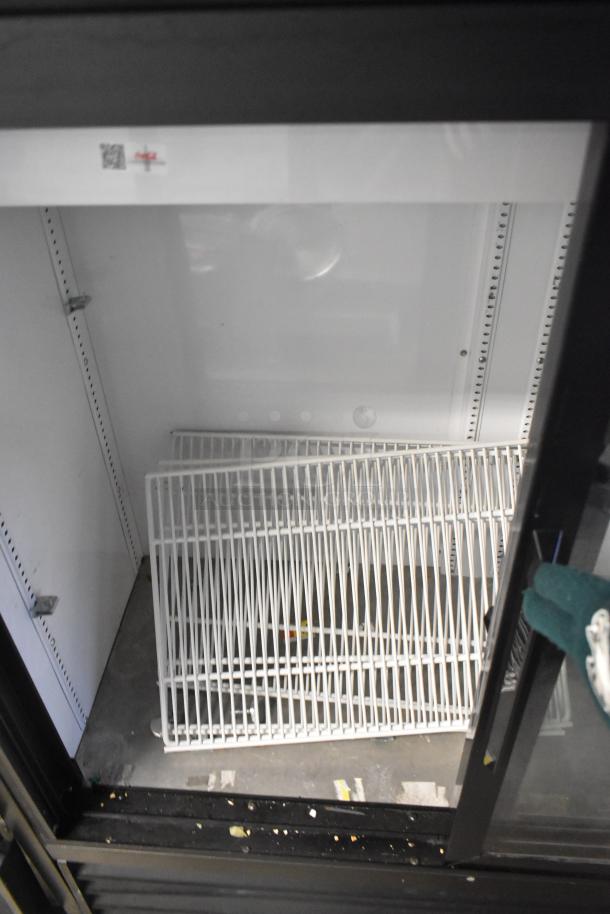 2018 True GDM-41SL-48-HC-LD two-door cooler with poly-coated racks, commercial use, 115V, in good condition.