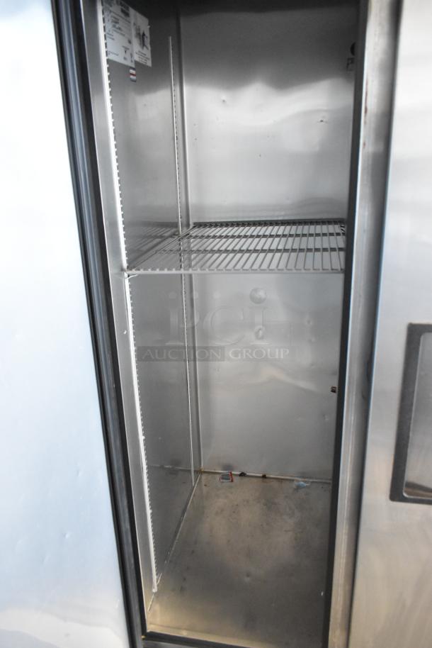 2017 True T-35 stainless steel 2-door commercial cooler with poly-coated racks, 115 volts, 1 phase, clean interior.