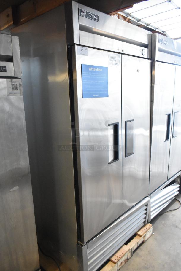 2017 True T-35 stainless steel 2-door commercial cooler with poly-coated racks, tags visible, 115 volts, 1 phase.