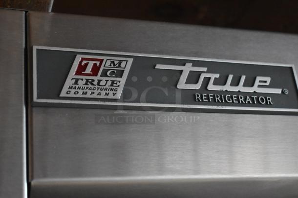 2017 True T-35 stainless steel commercial cooler, 2 doors, poly coated racks, 115 volts, logo visible on door.