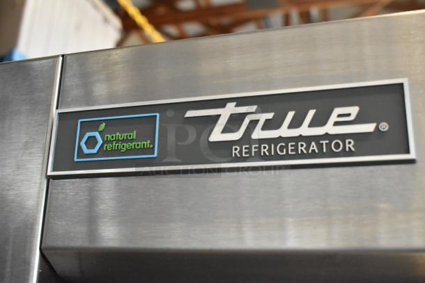 2018 True T-35 stainless steel 2-door reach-in cooler with "natural refrigerant" label. Model features poly-coated racks.