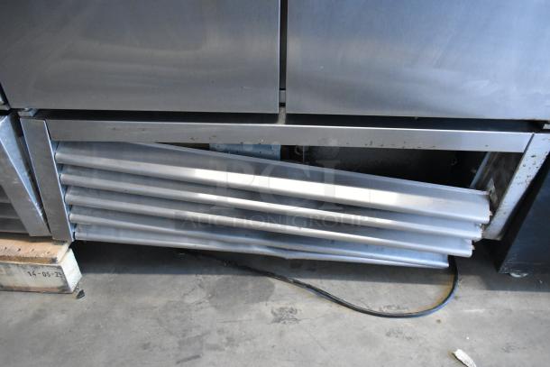 2018 True T-35 stainless steel commercial cooler, 2 doors, poly coated racks, 115 volts, 1 phase, visible dent.