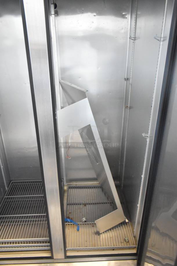 2018 True T-35 stainless steel commercial cooler, 2 doors, poly coated racks, 115V, visible interior wear, clean exterior.