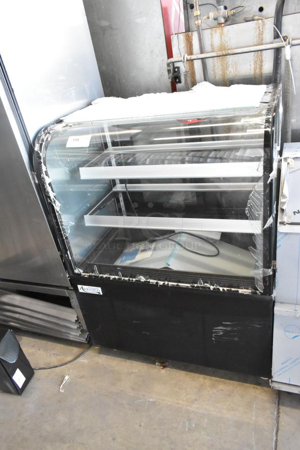 Avantco 193BCD36B black bakery display case with curved glass, minor glass damage visible. New, 115V, 1-phase, 36".