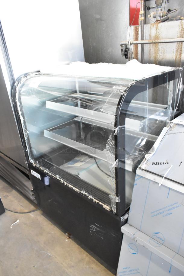 Brand new Avantco 193BCD36B 36" curved glass black dry bakery display case; visible glass damage; 115V, 1 phase.