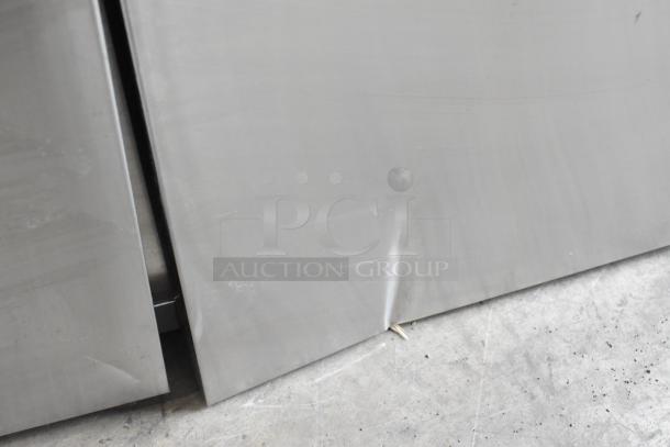 Brand new Avantco 178SSPPT3 pizza prep table with visible scratches and dents, stainless steel, 115V, 1 Phase.