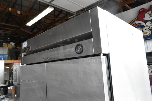 True T-35 stainless steel commercial 2-door reach-in cooler, poly coated racks, 115 volts, 1 phase, visible thermometer.