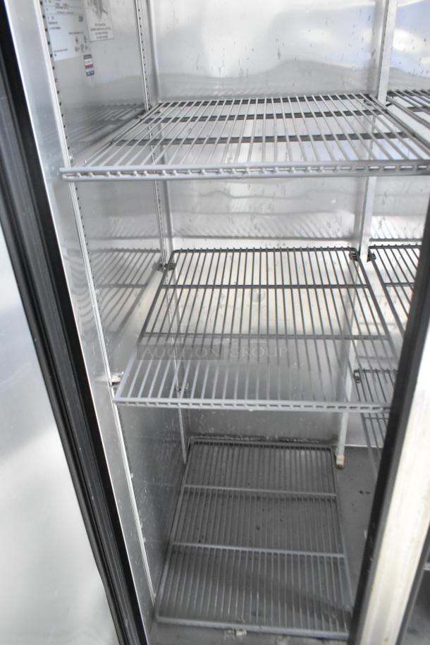 True T-35 stainless steel commercial 2-door reach-in cooler with poly-coated racks, 115 volts, 1 phase, interior view.