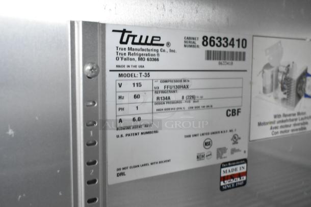 True T-35 commercial cooler label displays model, voltage, phase, and refrigerant info. Features NSF certification.