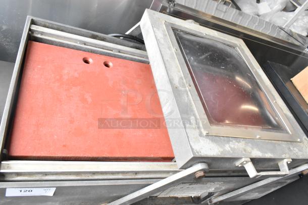 Bizerba stainless steel commercial vacuum sealer with transparent lid, red sealing surface, on casters. Some wear visible.