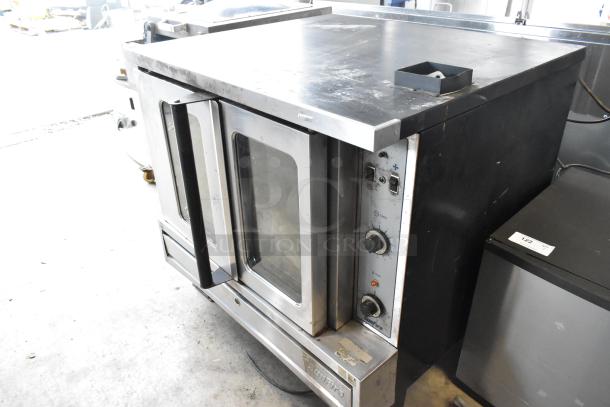 Garland SunFire SDG-1 stainless steel commercial convection oven, gas-powered, view-through doors, metal racks, thermostatic controls.