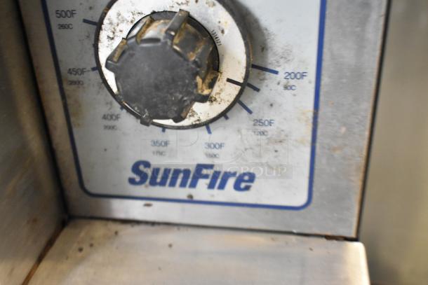 Close-up of Garland SunFire SDG-1 convection oven thermostatic control, showing temperature settings and branding.