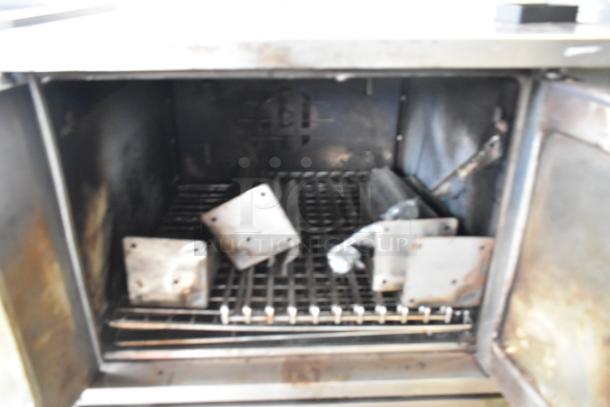 Garland SunFire SDG-1 stainless steel commercial convection oven interior, metal racks, used condition, 80,000 BTU.