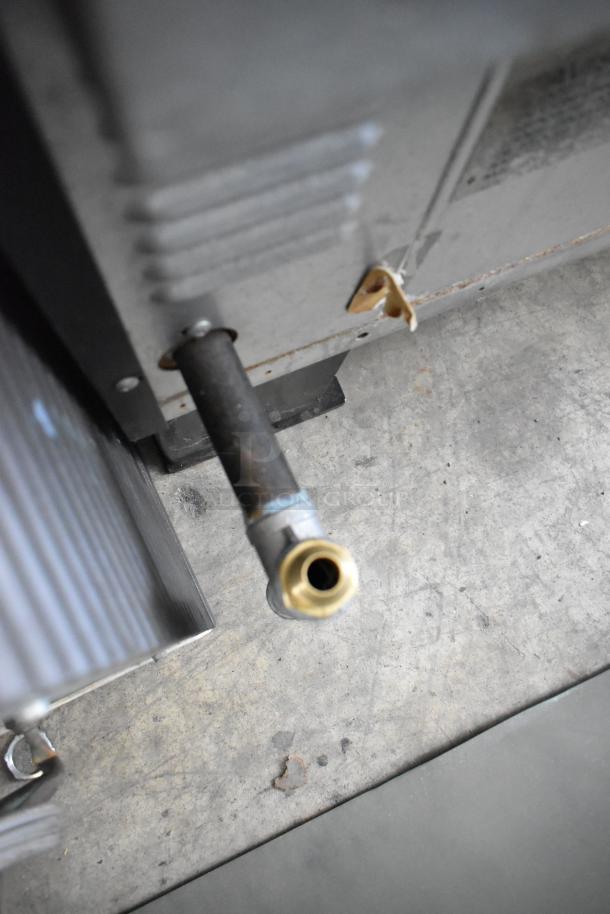 Gas inlet of the Garland SunFire SDG-1 stainless steel convection oven, showing metal connection.