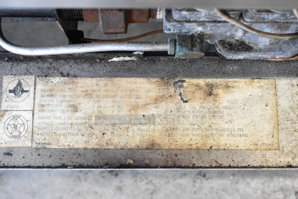 Garland SunFire SDG-1 convection oven label showing model, serial number, BTU rating, and installation instructions.