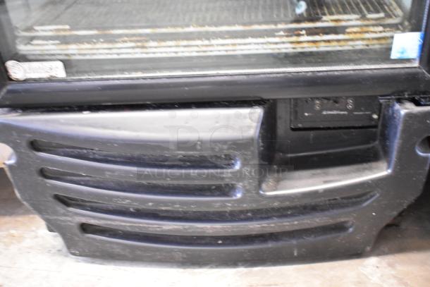 Imbera G318 Metal Commercial Single Door Cooler Merchandiser. 115V, 1 Phase. Visible wear on lower panel.