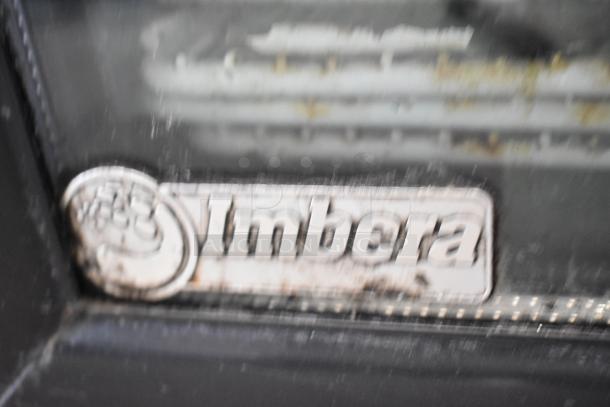 Imbera G318 metal commercial cooler with single door, model label visible, operates at 115 volts, 1 phase.