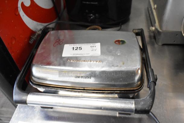 Hamilton Beach Panini Press with visible label, some wear. Includes 120V slow cooker, 1 phase. Bid for 2 items.
