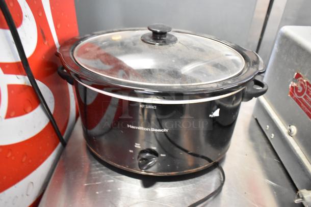 Hamilton Beach slow cooker with glass lid and temperature dial, 120 volts, 1 phase. Includes additional Panini press.
