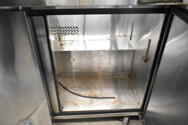 Atosa MSF8108 stainless steel commercial prep table, 115 volts, 1 phase. Features inner storage space, visible wear.