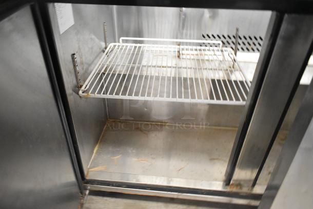 Atosa MSF8108 stainless steel prep table interior, showing wire shelf. Commercial-grade, 115 Volts, used condition.
