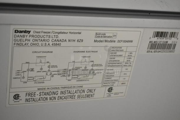Danby DCF100A6WM chest freezer label showing circuit diagram, model specifications, and installation details.