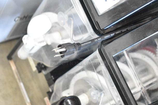 Crathco stainless steel countertop 2 hopper slushie machine, 115 volts, 1 phase, visible power cord, used condition.