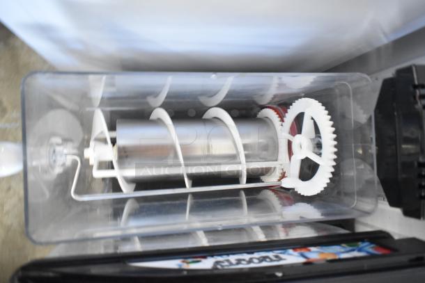 Crathco stainless steel 2 hopper slushie machine, countertop model, 115 volts, 1 phase, visible gears and mechanism.
