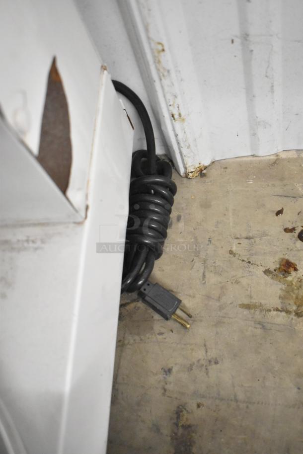 Dough Xpress DXE-W metal countertop dough press, 120 volts, shown in storage with power cord. Used condition.