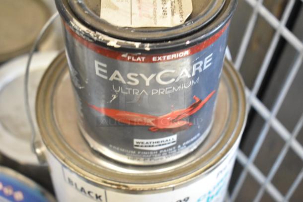 15 Pro Guard cans including 1520-2 Pro Flex Base Coat Part B, Liquid Rubber. EasyCare Ultra Premium visible, worn condition.