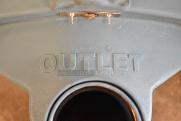 Trapzilla grease trap piece with "OUTLET" marking, features threaded insert and visible connector bolts, in good condition.