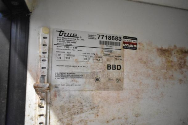 True TUC-44F freezer label; made in USA, 115 volts, 1 phase, serial 7718683, NSF certified, refrigerant R404A, worn condition.