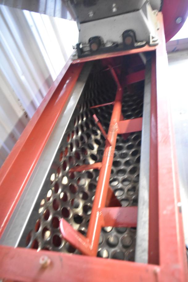 Pillan Metal Commercial Countertop Cookie Depositor, featuring a red frame and perforated metal tray, used condition.