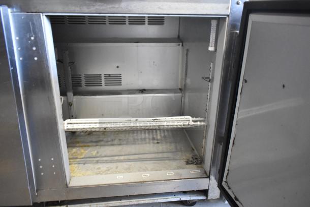 Beverage Air UCR48A stainless steel commercial 2-door undercounter cooler, visible interior shelving, 115V, 1 Phase. Used condition.