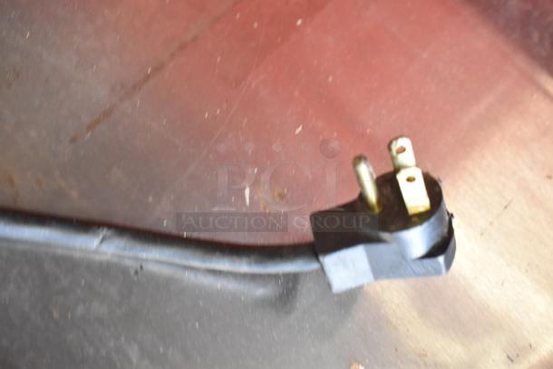 Close-up of a three-prong power plug for a Beverage Air UCR48A undercounter cooler, 115 volts, 1 phase.